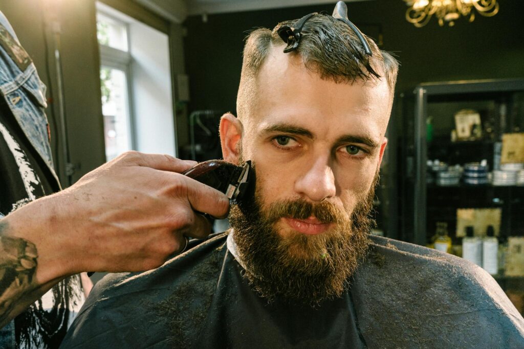 A Barber Shaving a Man's Beard